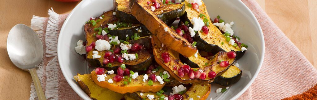 Orange and Thyme Roasted Acorn Squash with Pomegranate Seeds