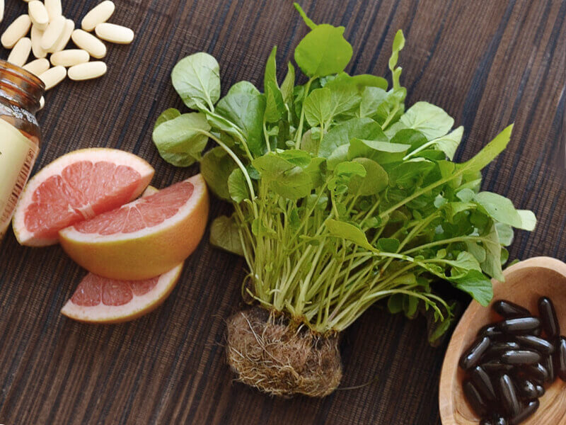 Fruits, vegetables and medicine on a table